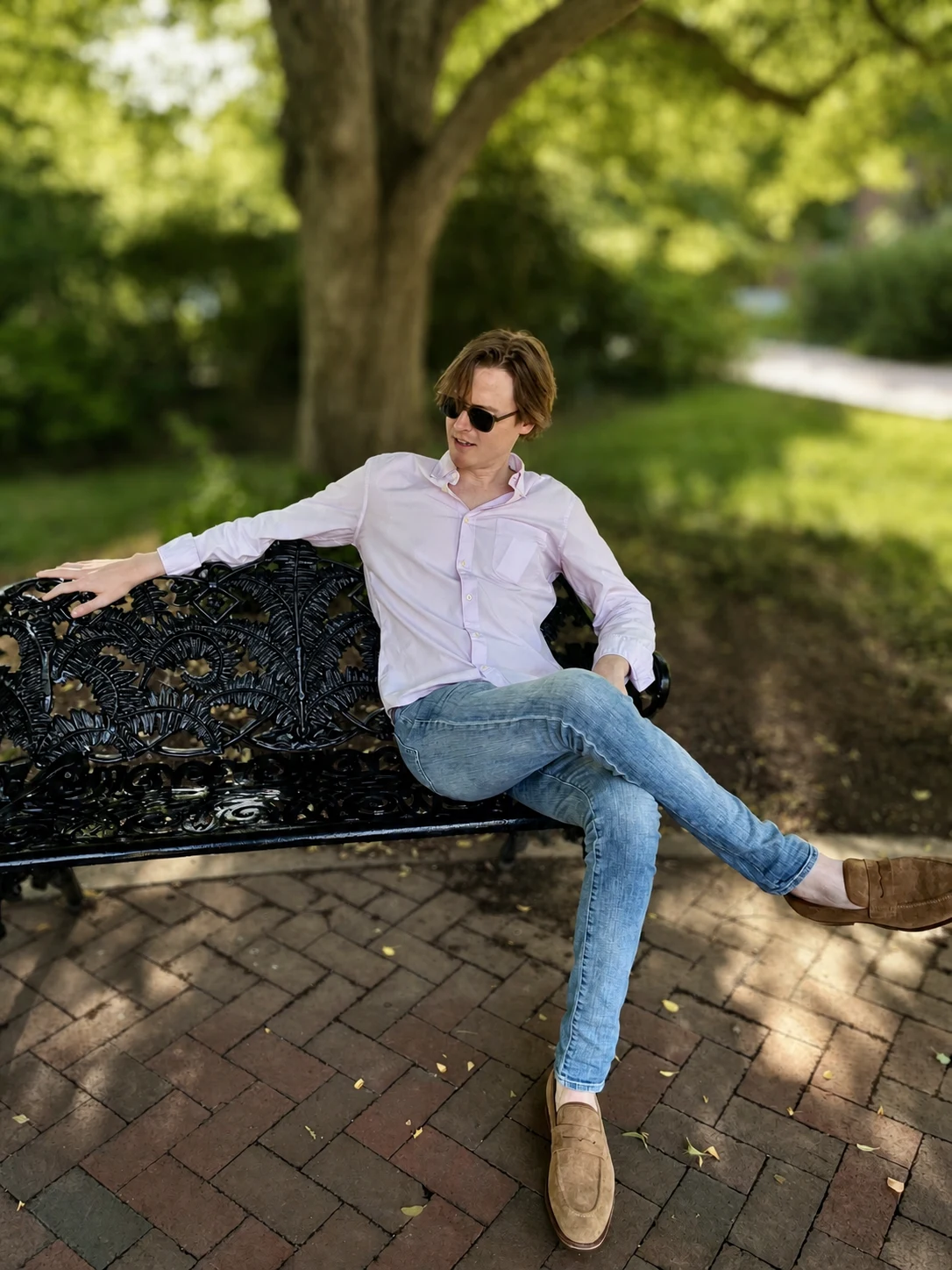Ashton Wolfley seated in a garden